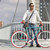 A young stylish man with sunglasses posing next to his bicycle. stock photo © 2Design