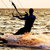 Silhouette of a kitesurfer on a waves stock photo © acidgrey