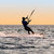 Silhouette of a kitesurfer on waves of a gulf  stock photo © acidgrey