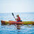 Woman With Safety Vest Kayaking Alone on a Calm Sea stock photo © aetb