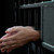 celda · de · la · cárcel · puerta · manos · primer · plano · prisión - foto stock © albund