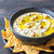 Bowl of hummus with tortilla chips stock photo © Alex9500
