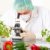 Researcher with microscope with a GMO vegetables in the laborato stock photo © Amaviael