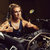 Blond woman mechanic showing thumbs up in a motorcycle workshop stock photo © amok