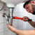 vízvezetékszerelő · javít · mosdókagyló · fürdőszoba · fiatal · férfi - stock fotó © AndreyPopov