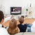 Young family watching TV at home stock photo © AndreyPopov