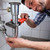 vízvezetékszerelő · javít · mosdókagyló · fürdőszoba · fiatal · férfi - stock fotó © AndreyPopov