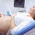 Cheerful pregnant woman on ultrasound stock photo © Anna_Om