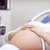 Happy pregnant woman on ultrasound stock photo © Anna_Om