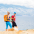 Couple hikers walking with dog at seaside and mountains stock photo © blasbike