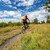 Mountain biker cycling riding in woods and mountains stock photo © blasbike