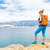 Woman hiker with backpack, hiking at seaside and mountains stock photo © blasbike