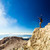 Hiking man or trail runner looking at view in mountains stock photo © blasbike