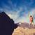 Man celebrating success in mountains, arms outstretched stock photo © blasbike