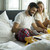 Couple having breakfast in their bed at home stock photo © boggy