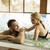 Loving couple relaxing in the pool at spa stock photo © boggy