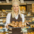női · pékség · pózol · különböző · sütemények · gyönyörű - stock fotó © boggy