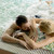 Loving couple relaxing at the spa in the pool stock photo © boggy