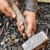 Detail of dirty hands holding hammer - blacksmith stock photo © brozova