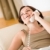 On the phone home: Smiling woman on sofa calling stock photo © CandyboxPhoto