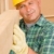 Handyman mature carpenter measure wooden beam stock photo © CandyboxPhoto