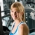Smiling woman at fitness center exercise machine stock photo © CandyboxPhoto
