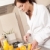 mulher · jovem · laranja · café · da · manhã · cozinha · roupão · de · banho - foto stock © CandyboxPhoto