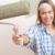 Home improvement: Young woman with paint roller  stock photo © CandyboxPhoto