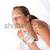 Body care series - Young woman with white bottle of lotion stock photo © CandyboxPhoto