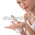 Body care series - Young woman with bottle of lotion stock photo © CandyboxPhoto