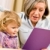 Grandmother and granddaughter read book together stock photo © CandyboxPhoto