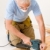 Home improvement - handyman sanding wooden floor  stock photo © CandyboxPhoto
