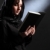 Religious young woman in headscarf reading bible stock photo © darrinhenry