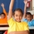 Three primary school children hands raised in class stock photo © darrinhenry