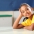 School girl 10 relaxed while sitting at her classroom desk stock photo © darrinhenry