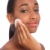 African woman uses cosmetics cleansing facial pad stock photo © darrinhenry
