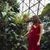 mulher · vestido · vermelho · posando · estufa · flor - foto stock © deandrobot