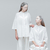 Two women looking at each other in white clothes stock photo © deandrobot
