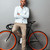 Young african man standing over grey wall with bicycle. stock photo © deandrobot