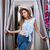 Beautiful young woman in dressing room of clothing shop stock photo © deandrobot