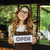 Portrait of a pretty young barista girl in apron stock photo © deandrobot