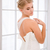 Bride putting on her white wedding dress stock photo © deandrobot