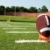 Closeup of American Football on Tee on Field stock photo © dehooks