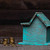 Wooden house model with coins next to it and hand stock photo © DenisMArt
