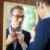 Young man dressing up and looking at mirror stock photo © diego_cervo