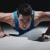 Man doing push-ups on black background stock photo © diego_cervo
