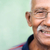 Old black man with glasses and mustache smiling stock photo © diego_cervo