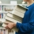 woman holding pile of books in library stock photo © diego_cervo