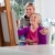 Women portrait with happy mom painting and daughter smiling stock photo © diego_cervo