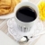 A cup of black coffee and croissants stock photo © Dinga
